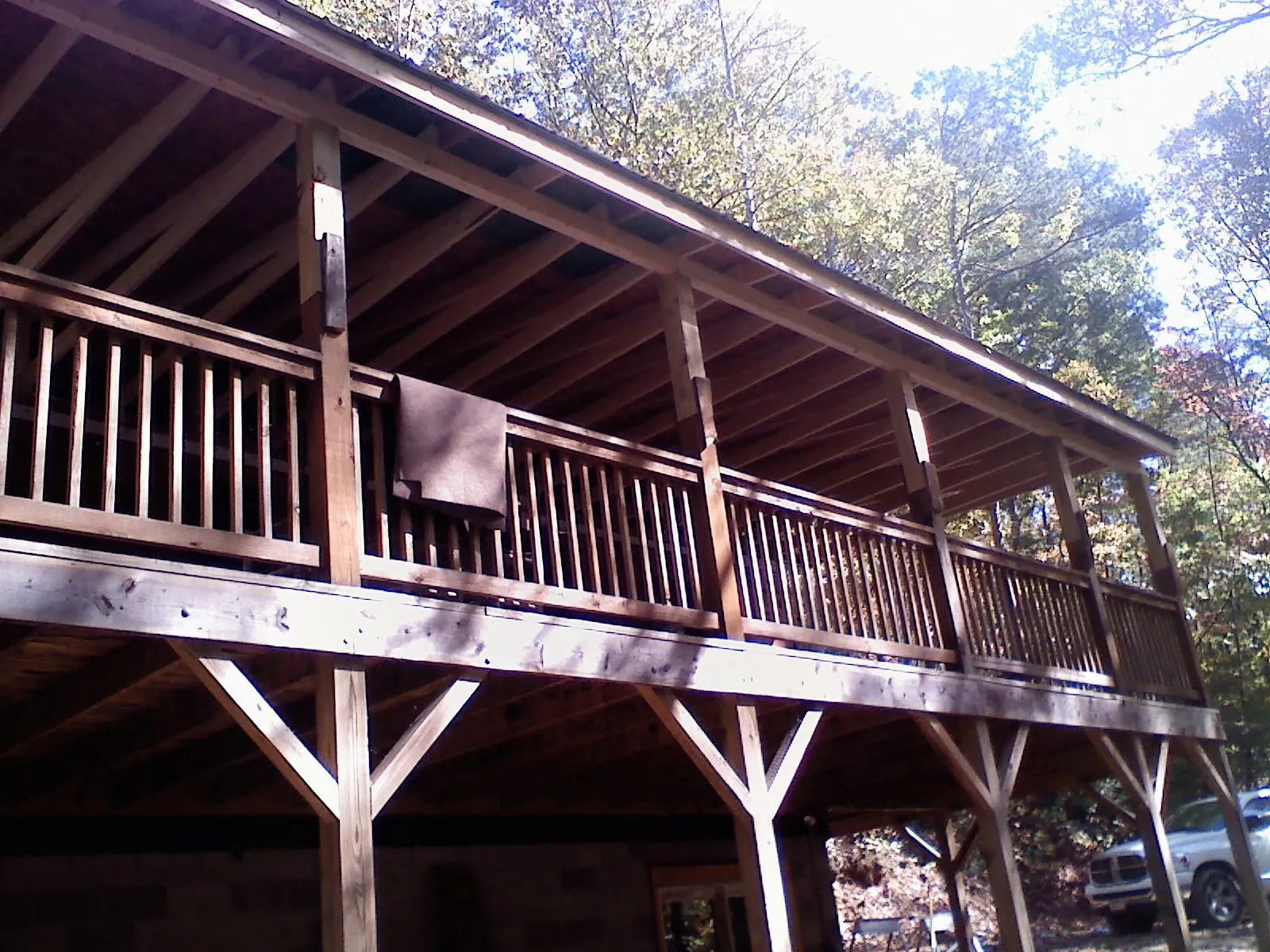 Timber framing under a new elevated porch and deck — Roof Leak Repair in Westford by Roofing Brothers